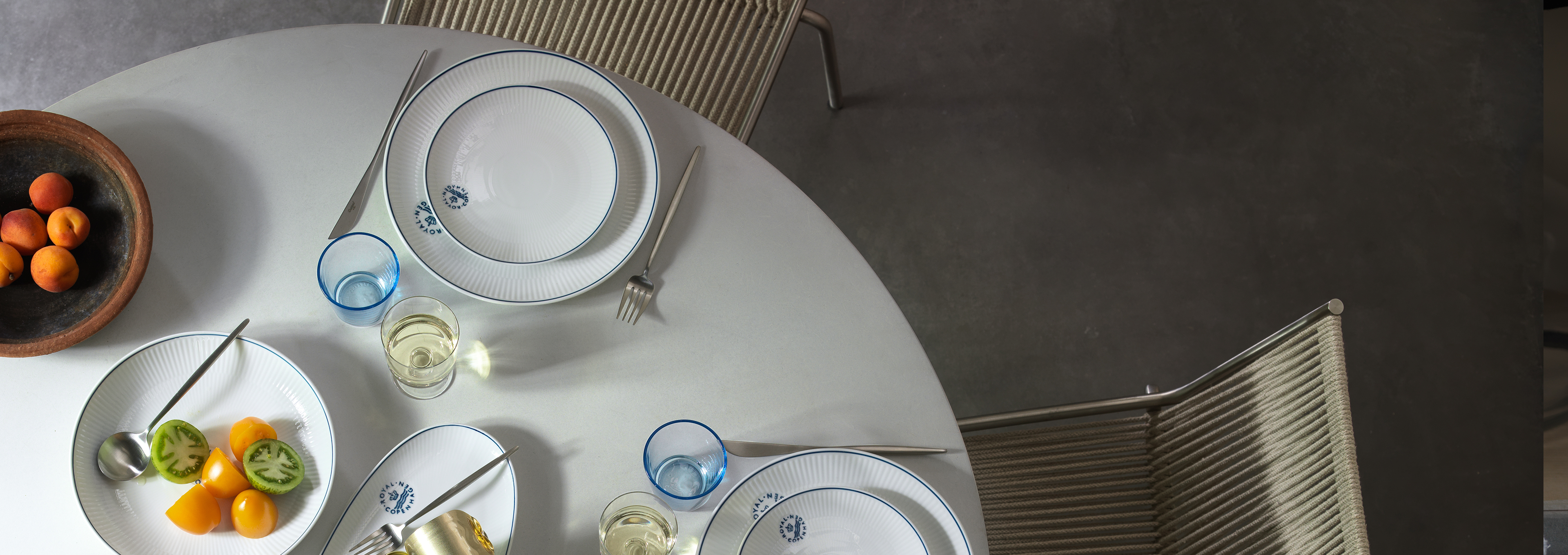 A lunch table set with the elegant Blueline porcelain.